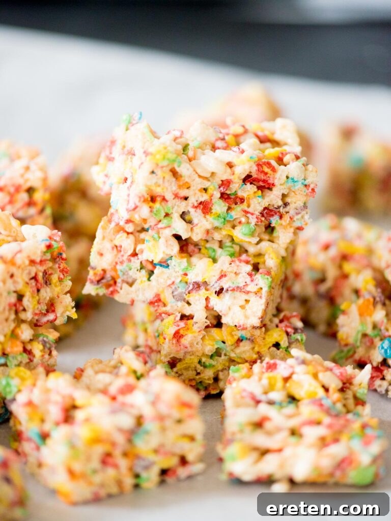 fruity pebbles rice krispie treats stacked on top of each other