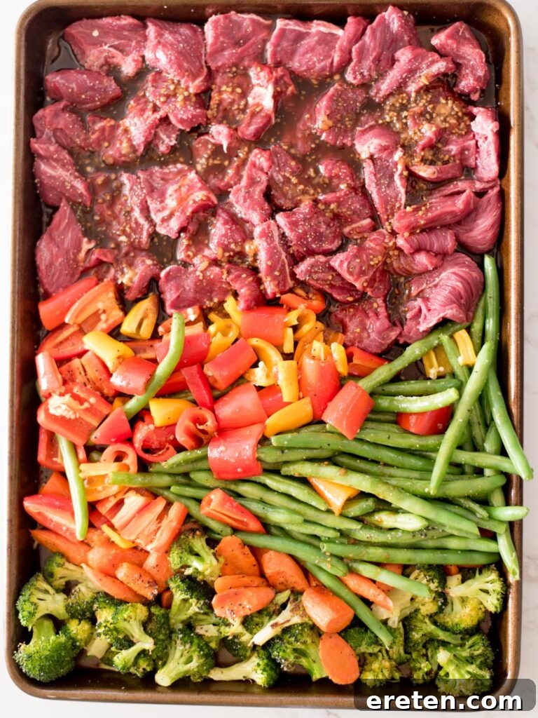 teriyaki sauce poured over all items on a sheet pan