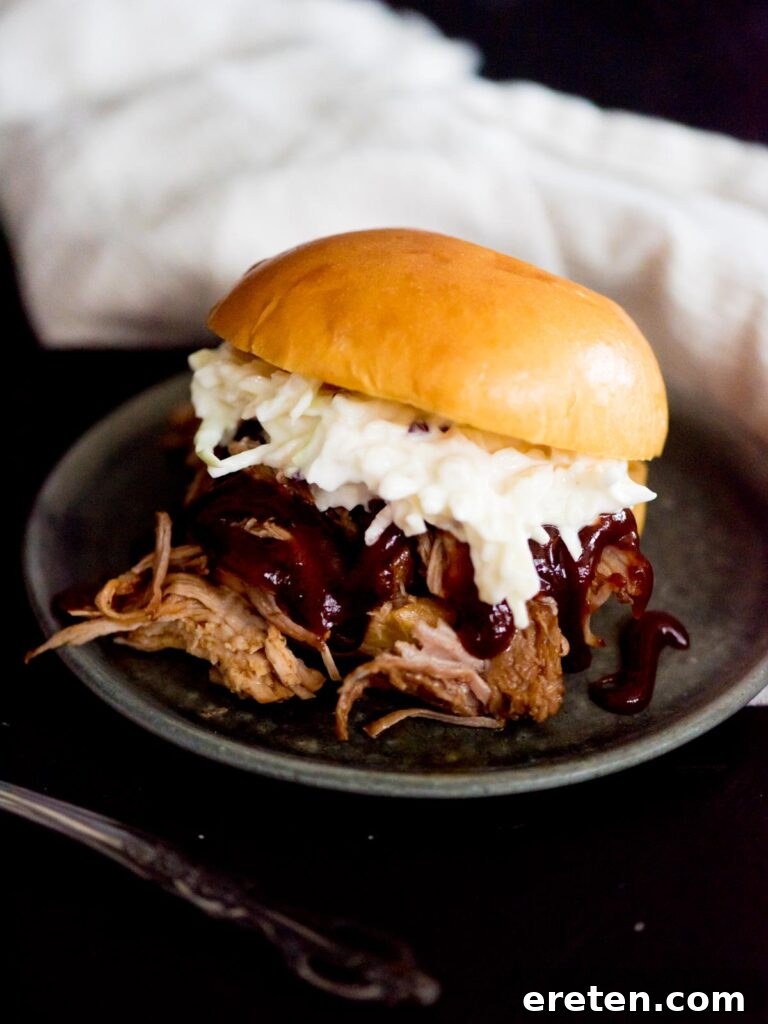 instant pot sweet pulled pork with bbq sauce and coleslaw in a brioche bun