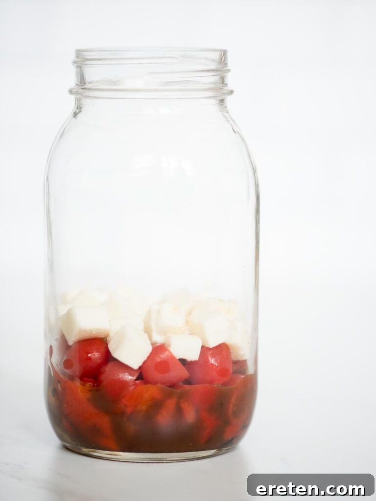 Layered Pesto Chicken Salad Jar 7 balsamic vinaigrette, roasted peppers, grape tomatoes, and mozzarella in a jar