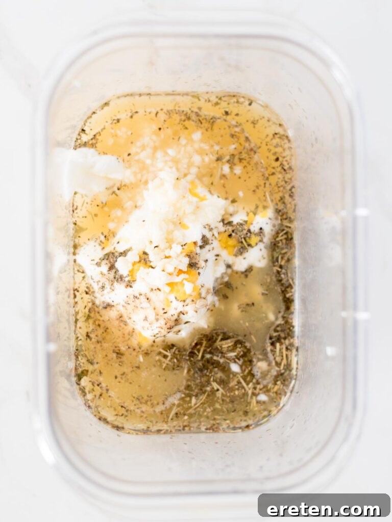 Minced garlic added to the marinade mixture in the bowl.