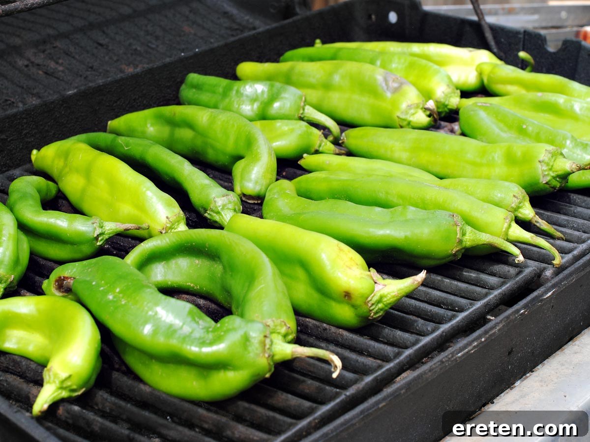 Fresh green chiles ready for roasting on a grill