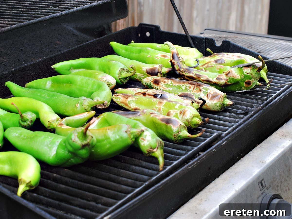 Green chiles blistering on a hot grill