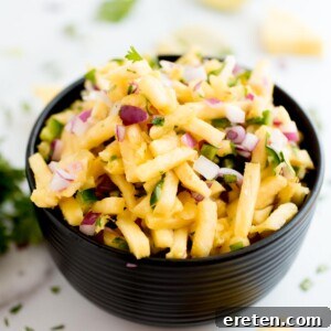 pineapple pico de gallo in a black bowl