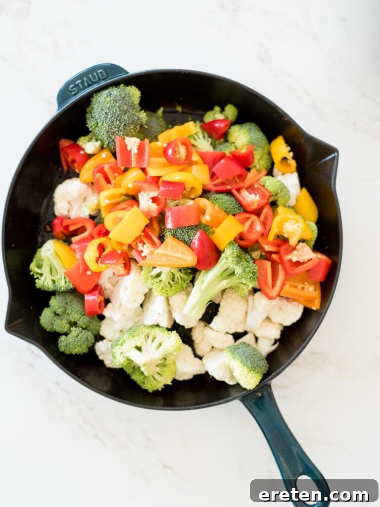 One-Pan Golden Chicken & Vibrant Veggies 7 vegetables added to the skillet with cooked chicken
