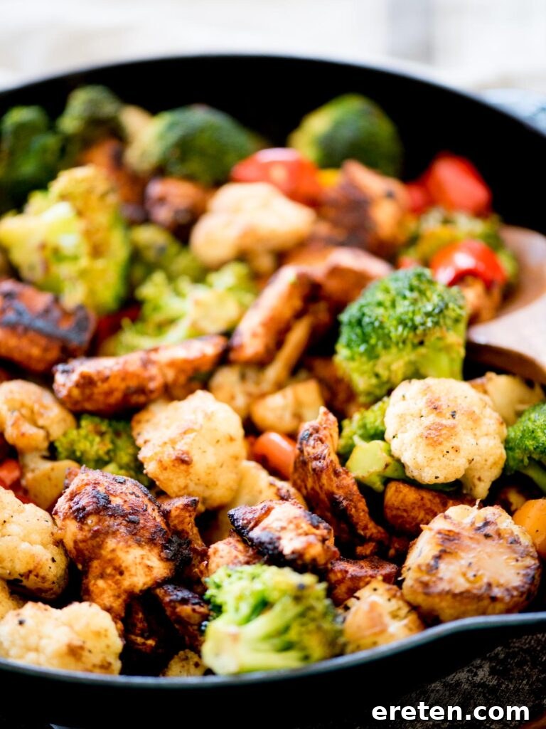 One-Pan Golden Chicken & Vibrant Veggies 8 healthy chipotle chicken and vegetables in a skillet with lime wedges