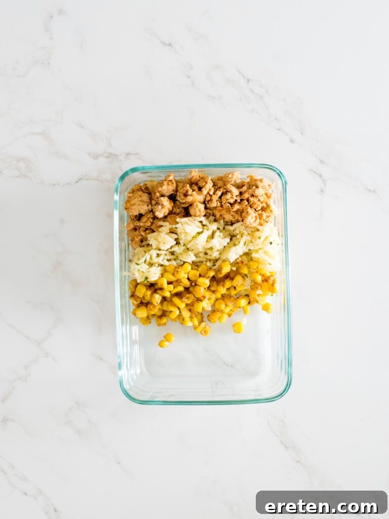 turkey, rice, and corn in glass container