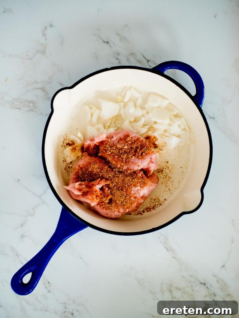 turkey, taco seasoning, and onion in a skillet