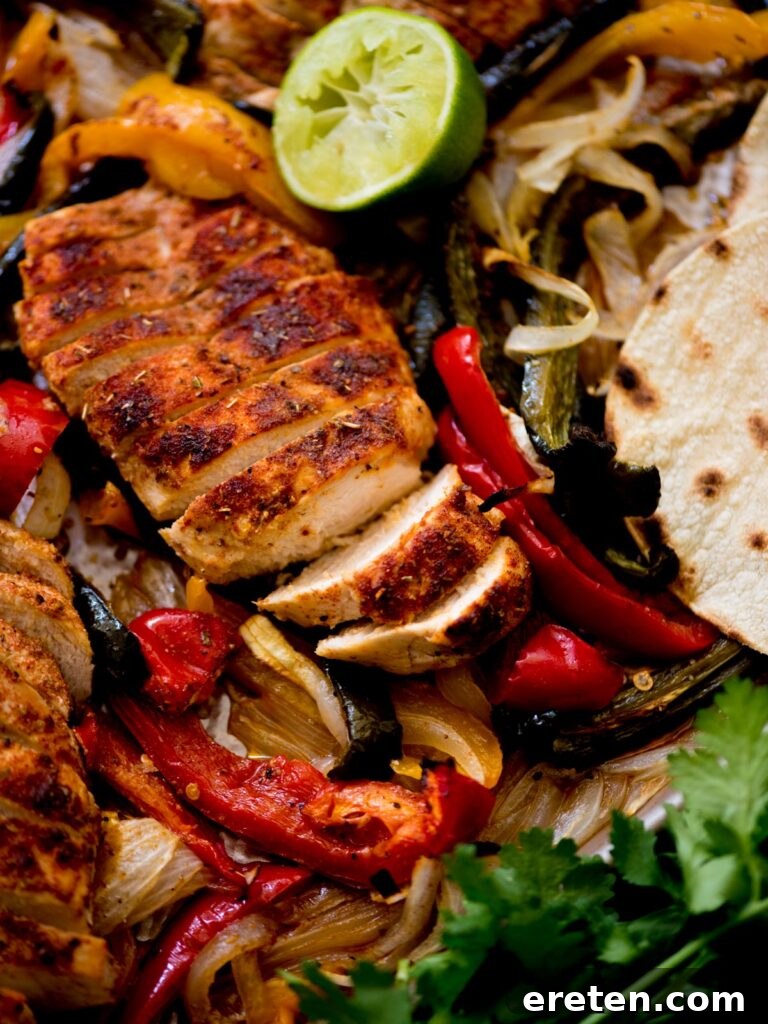 One Pan Chicken Fajita Dinner 9 sheet pan chicken fajitas with creamy cilantro lime sauce, tortillas, and limes