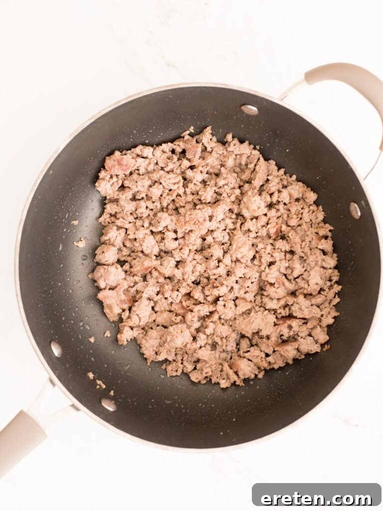 Golden Biscuit Breakfast Bake 5 breakfast sausage cooked in a skillet