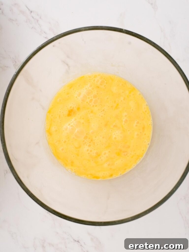 Golden Biscuit Breakfast Bake 6 whisked eggs in a bowl
