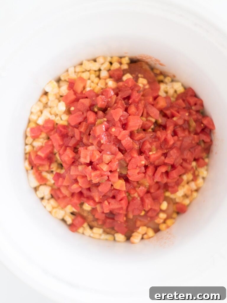 Easy Slow Cooker Mexican Chicken 7 Salsa being poured over the ingredients in the crockpot.
