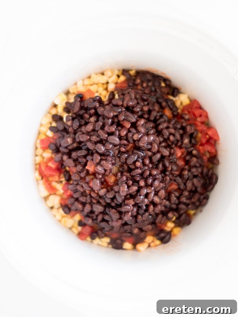 Easy Slow Cooker Mexican Chicken 8 Black beans added to the slow cooker mixture.