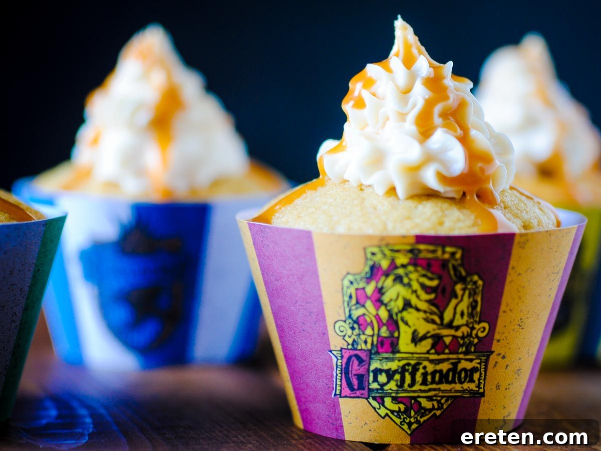 Enchanted Butterbeer Cupcakes 2 Delicious Butterbeer Cupcakes in Hogwarts house themed liners, perfect for any Harry Potter fan or wizard party.