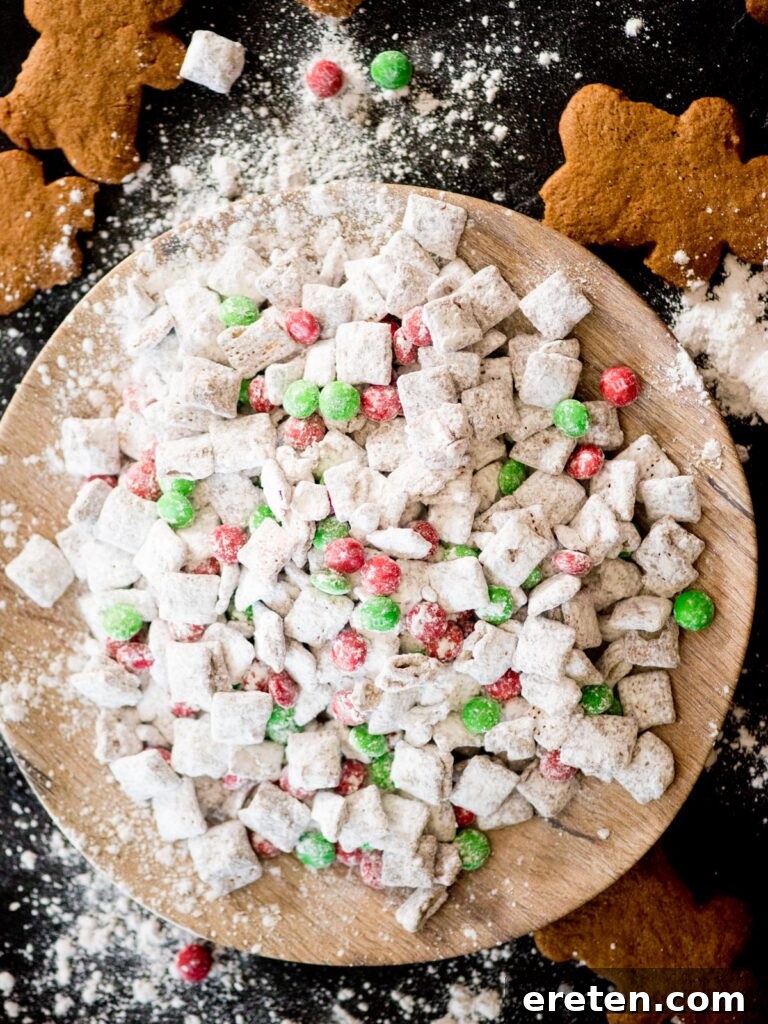 Festive Homemade Muddy Buddies 2 A festive plate of Reindeer Munch (Muddy Buddies recipe) with red and green M&Ms, ready for the holidays.