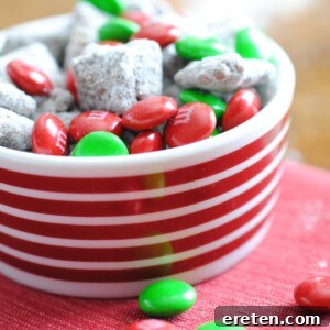 Festive Homemade Muddy Buddies 11 reindeer munch in a striped bowl