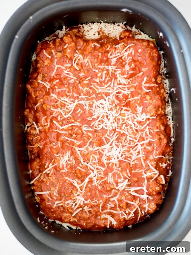 uncooked crockpot lasagna in the slow cooker