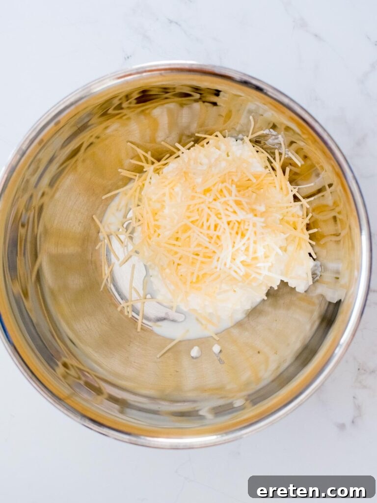 cottage cheese and parmesan in a mixing bowl