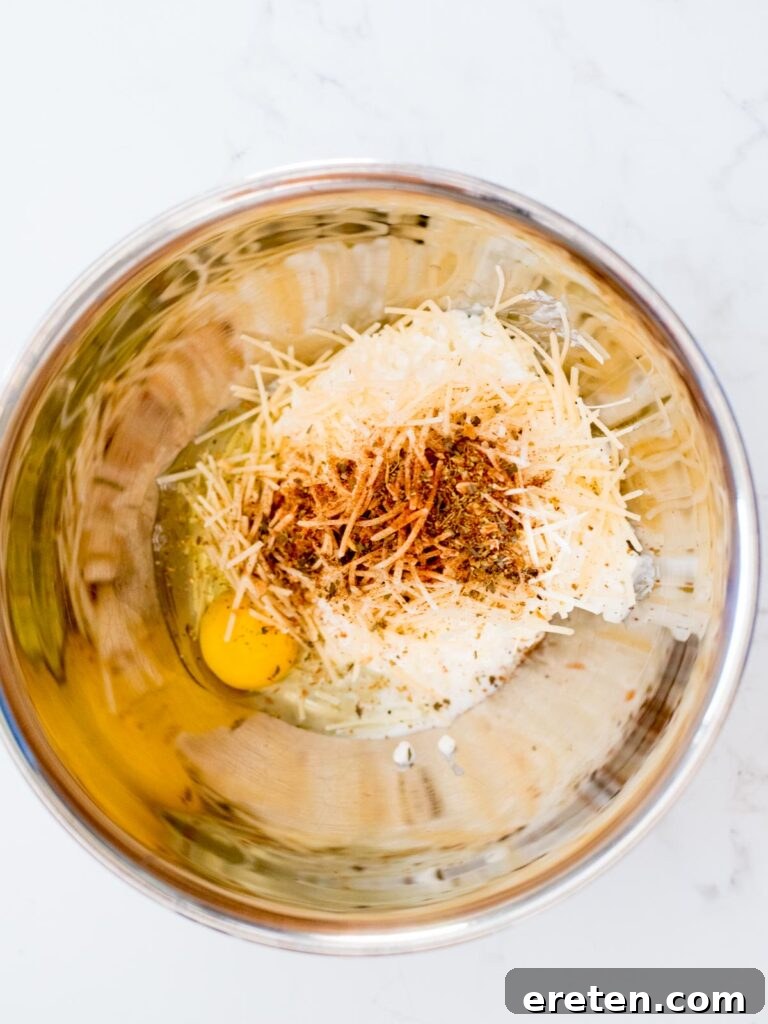 italian seasoning, egg, cottage cheese, and parmesan in a mixing bowl