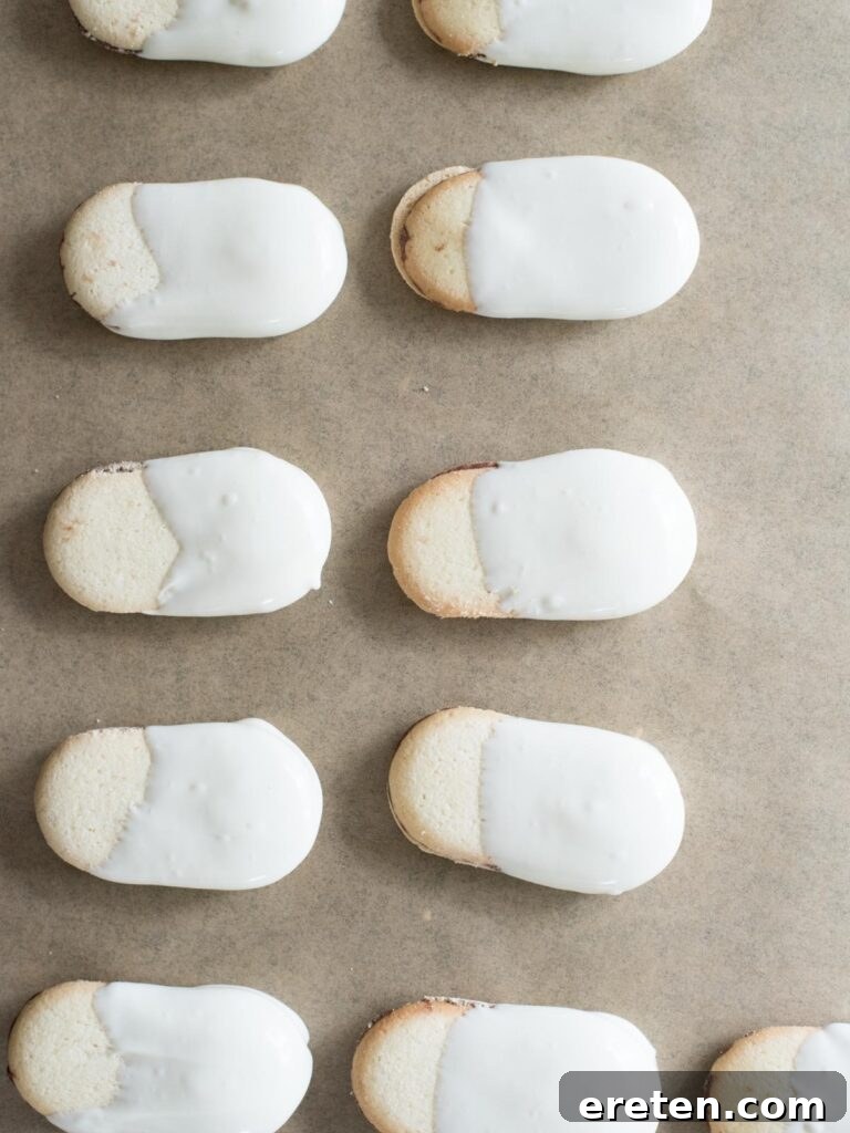 Milano cookies dipped three-quarters into melted almond bark