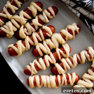 Mummy pigs in a blanket on a serving tray