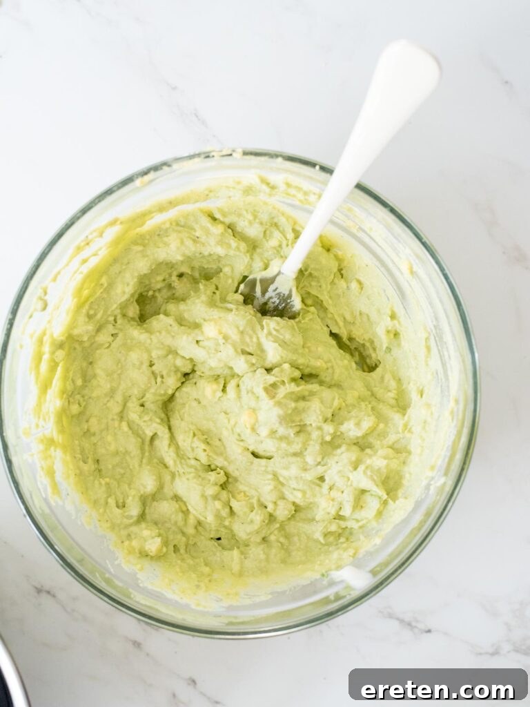 The fully mixed, creamy egg filling in a mixing bowl, before any additional coloring.