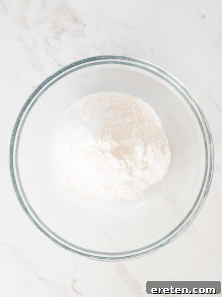 Instant pudding mix poured into a mixing bowl, ready for the addition of milk.