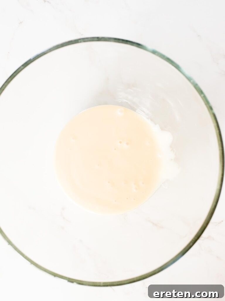 A can of sweetened condensed milk, such as Eagle Brand, in a separate mixing bowl.