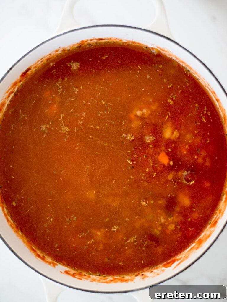 Quick and Comforting Pasta Fagioli 13 chicken stock added to the dutch oven