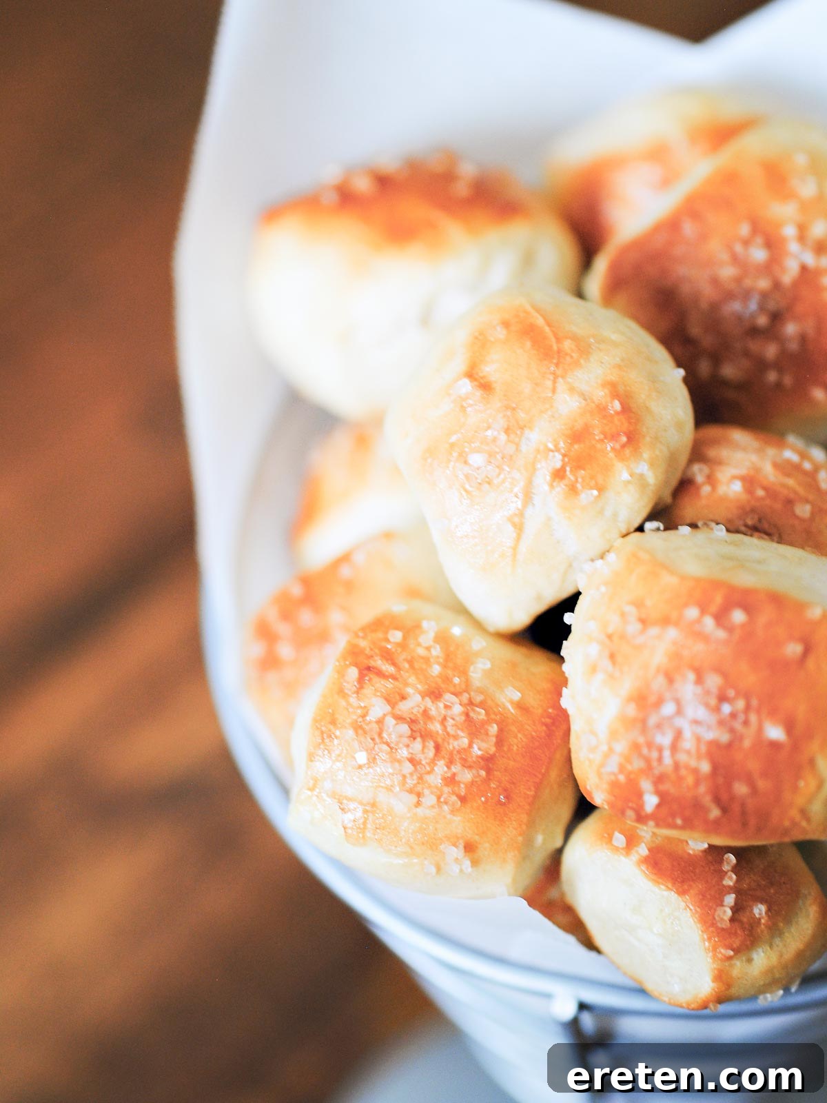Pillowy Pretzel Bites 2 pretzel bites in a parchment lined container